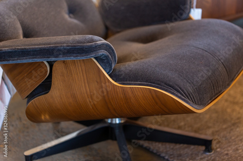 Close up details of fabric and wood modern chair photo