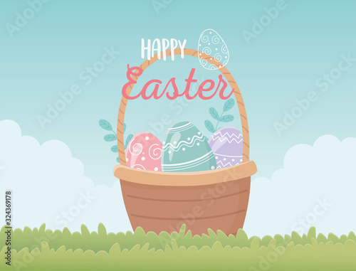 happy easter basket with eggs decoration in grass