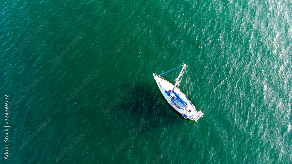 View of a sailboat in the ocean from above