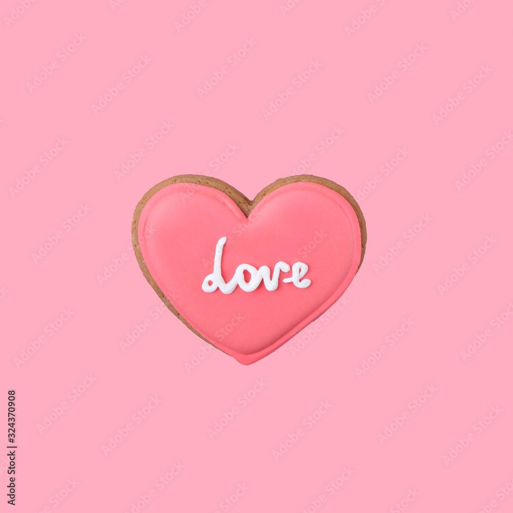 One sweet pink heart on pink background. Valentine's day minimal creative concept. close up. copy space
