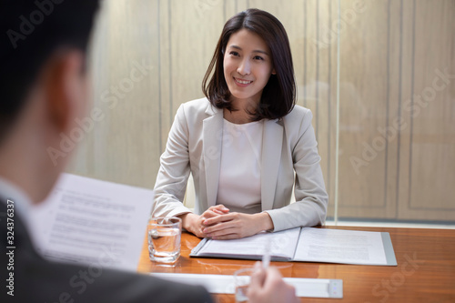 Young Chinese businesswoman in job interview