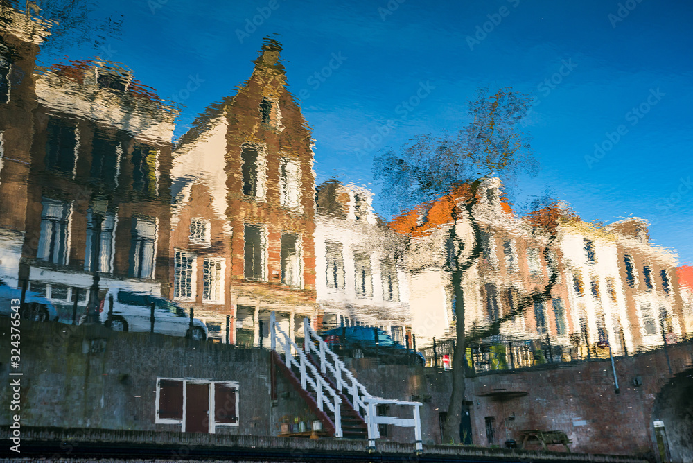 Utrecht, Netherlands - January 06, 2020. Historic houses in reflection on the water in canal