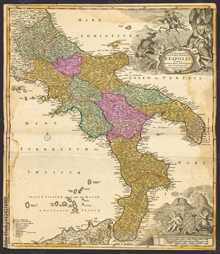 Southern Italian peninsula map: Homann, Johann Baptist, 1663-1724 (Cartographer). Decorative map of the Kingdom of Naples, with cartouches showing cherubs. Mt Vesuvius in the lower right corner. photo