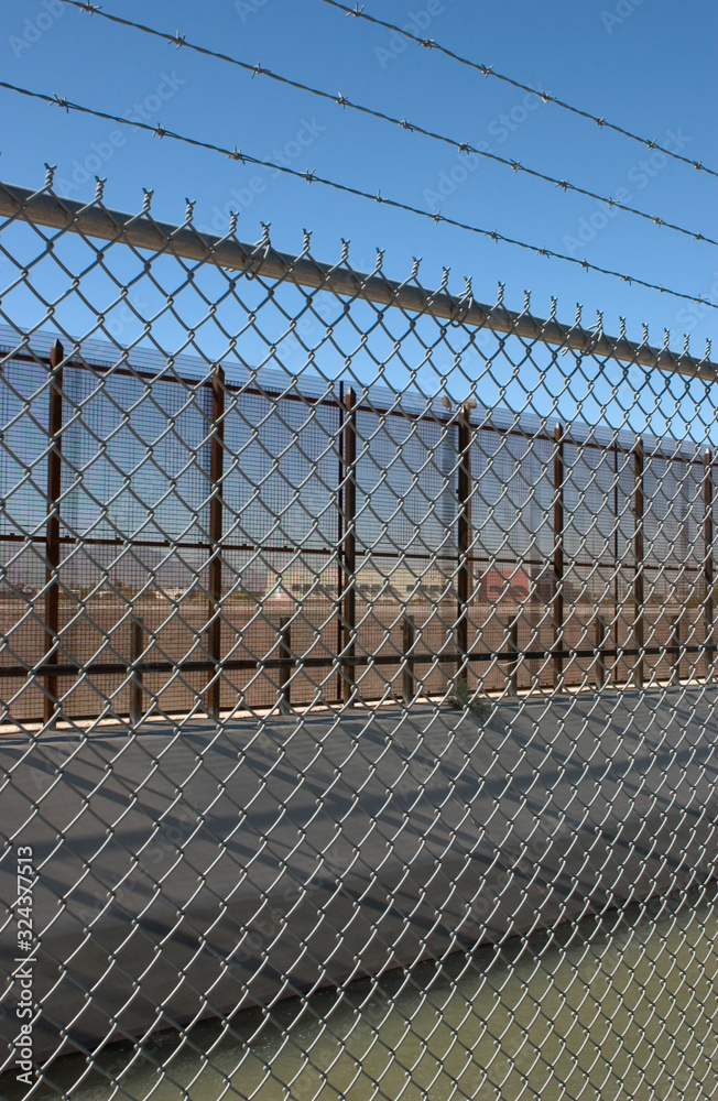 US Border Fence ,irrigation canal,barbed wire