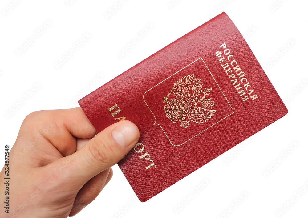 Russian foreign passport in the hand isolated on white background Russian foreign passport in the hand isolated on white background
