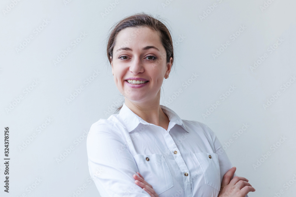 Happy girl smiling. Beauty portrait young happy positive laughing brunette woman on white background isolated. European woman. Positive human emotion facial expression body language Happy girl smiling. Beauty portrait young happy positive laughing brunette woman on white background isolated. European woman. Positive human emotion facial expression body language