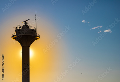 light tower silhouette at sunset