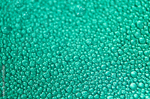 Water drop texture on turquoise background