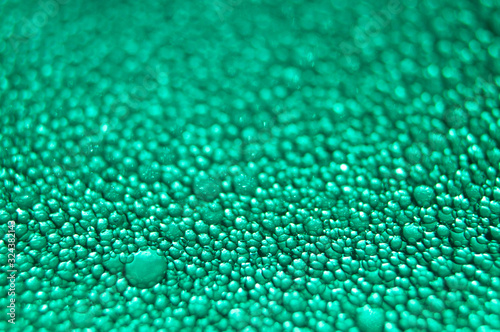 Water drop texture on turquoise background