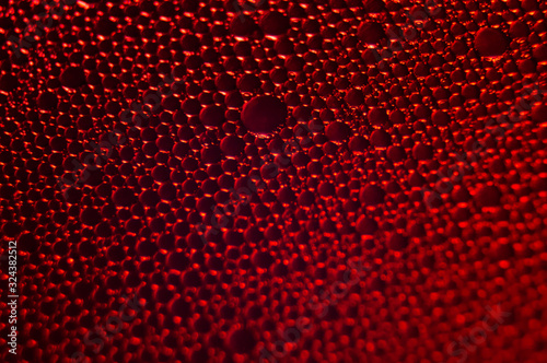 Water drops texture on red background