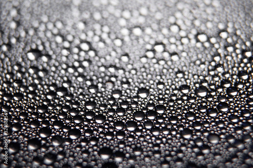Water drops texture on black background