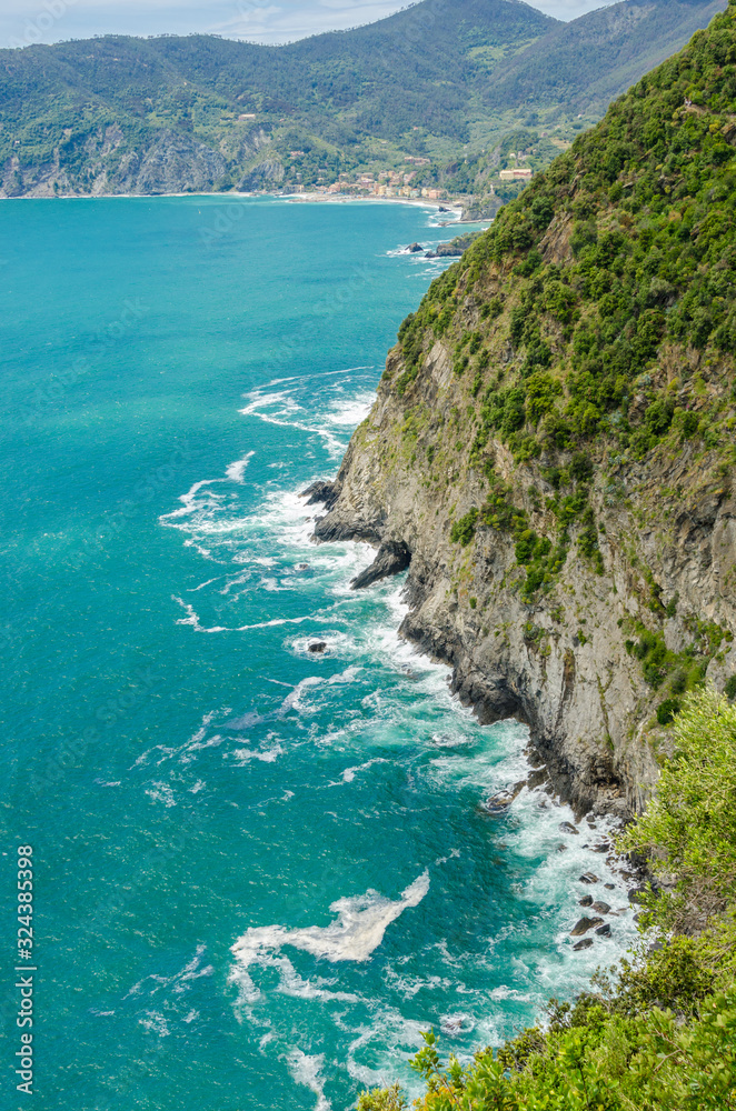 Majestic rocky and ocean view from famous trail between Monterosso and Vernazza, Italy.