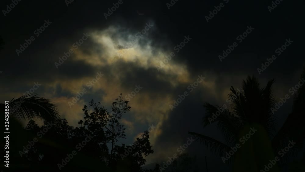 Timelapse of moon light shining through clouds on tropical beach Timelapse of moon light shining through clouds on tropical beach