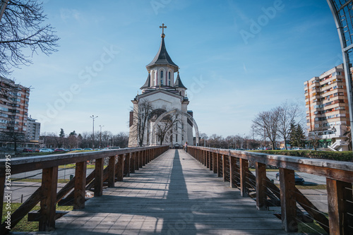Wooden bridge towards an Orthodox church