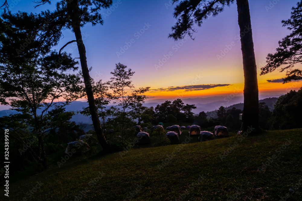 landscape of mountains , sunset ,pine tree ,Camping tent ,Thailand .