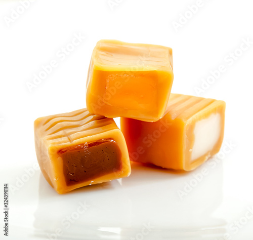 caramel toffee group with chocolate and cream filling close-up isolated on white background