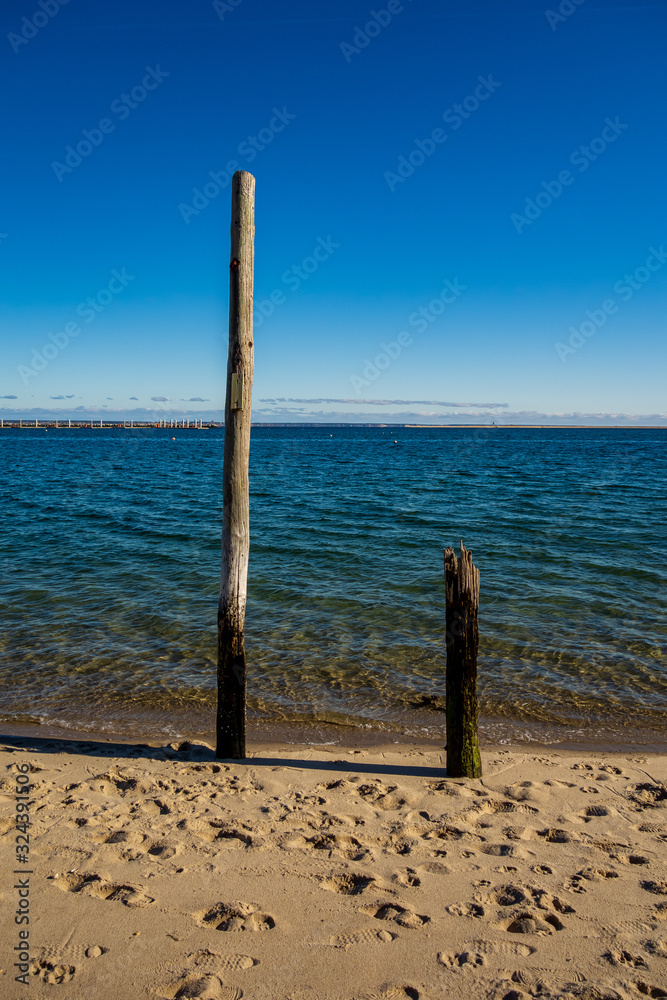 Old pier posts on beach - Prvincetown, Massachusetts Old pier posts on beach - Prvincetown, Massachusetts