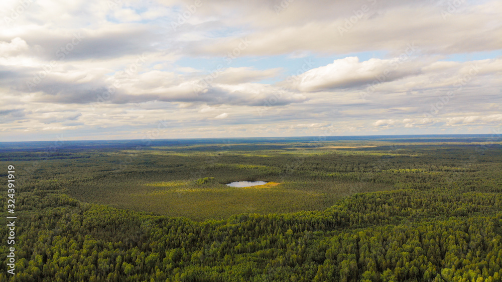 Aerial shooting a magic Taiga lake in Russia