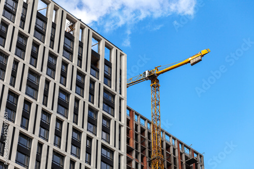 Construction of a modern residential complex. The construction of a multi-story building. cargo crane © Саша Потапов