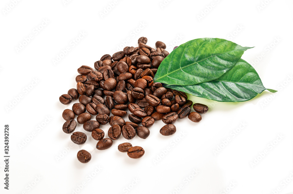 Naklejka premium Coffee beans with leaves isolated on white background.