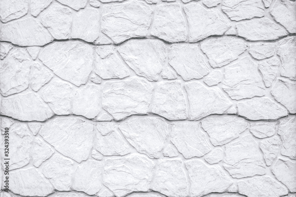 imitation of masonry. use of stone in construction. neutral gray background with place for text imitation of masonry. use of stone in construction. neutral gray background with place for text