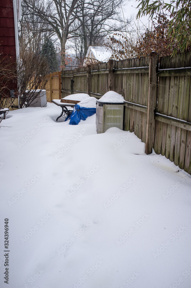 backyard covered with snow in winter backyard covered with snow in winter