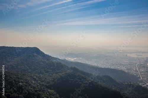 View of Rio de Janeiro with sprawling mountains taken from the Alto da Boa Vista Christ the Redeemer (Cristo Redentor) viewpoint on a clear day with a blue sky in Rio, Brazil, South America