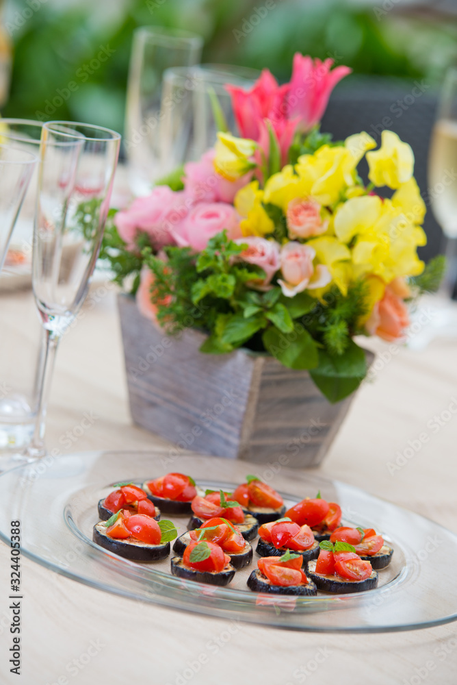 Food and flowers at a banquet or wedding reception celebration Food and flowers at a banquet or wedding reception celebration