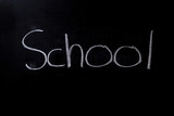 School written on a chalkboard in chalk