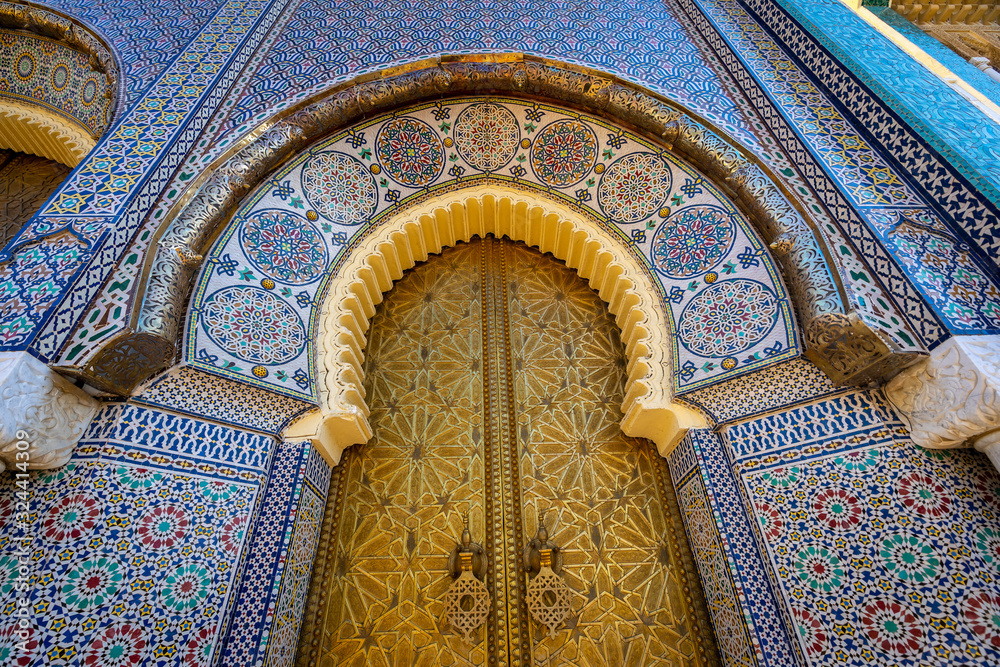 Upright view at the golden palace door with ornamental decorations in Fes, Morocco - obrazy, fototapety, plakaty 
