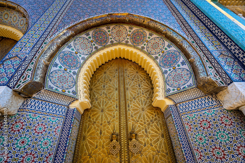 Upright view at the golden palace door with ornamental decorations in Fes, Morocco photo