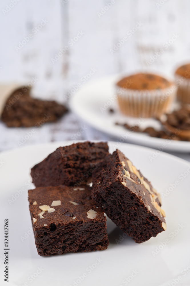 Chocolate brownies on a white plate. Chocolate brownies on a white plate.
