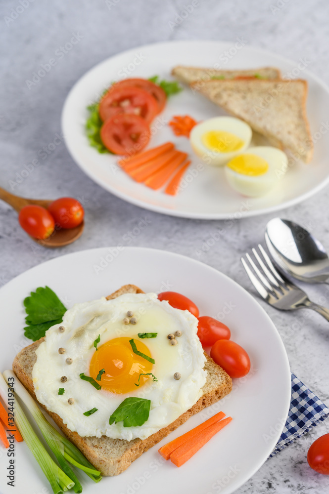 A fried egg laying on a toast, topped with pepper seeds with carrots, baby corn and spring onions. A fried egg laying on a toast, topped with pepper seeds with carrots, baby corn and spring onions.