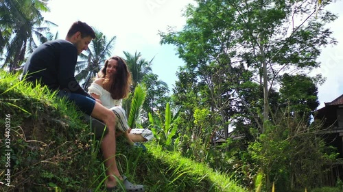 Couple, man and woman flirting in the jungle. . summer love in the tropical forest. Hamanoura Rice Terraces, Saga Prefecture, Japan. photo