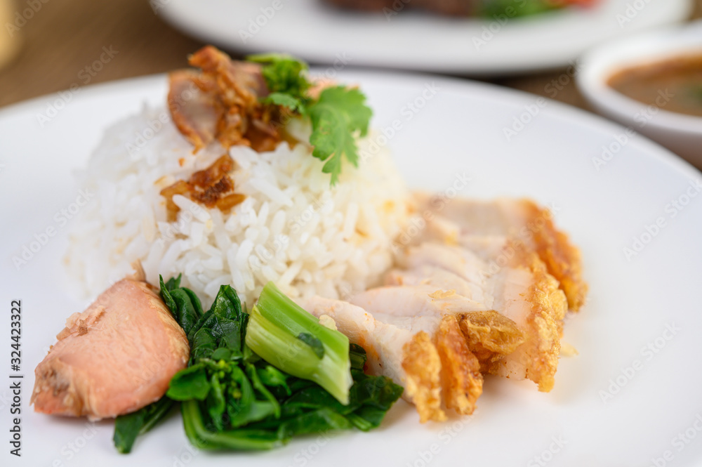 Crispy pork on a white plate. Crispy pork on a white plate.