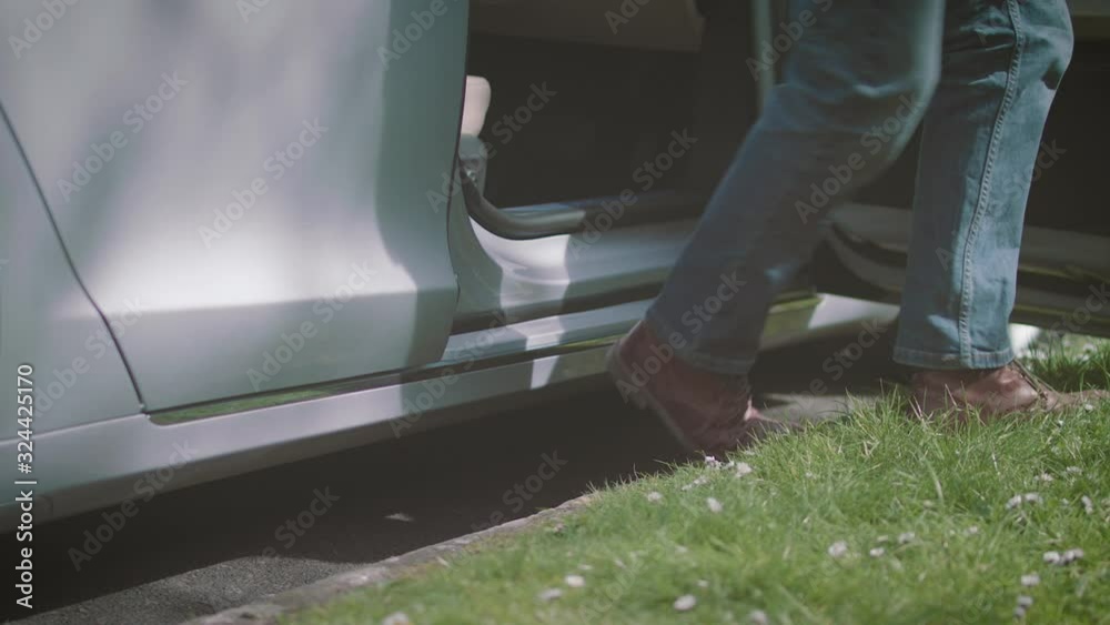 Tesla Model S door opening low angle as driver steps out Tesla Model S door opening low angle as driver steps out