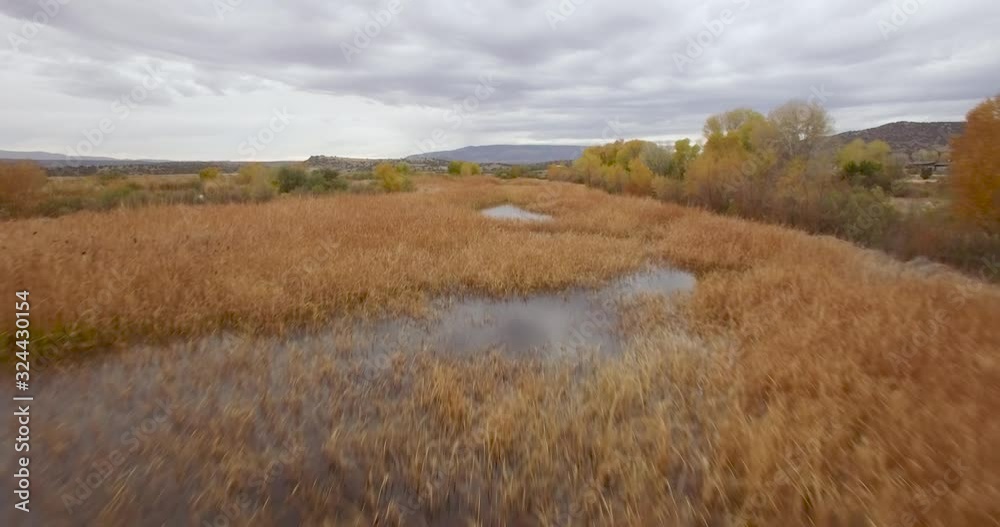 Aerial, low pass over the basins of the Sedona Wetlands Preserve. Aerial, low pass over the basins of the Sedona Wetlands Preserve.