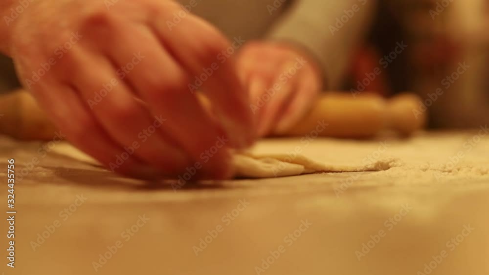 Rolling out fresh pizza dough. Rolling out fresh pizza dough.