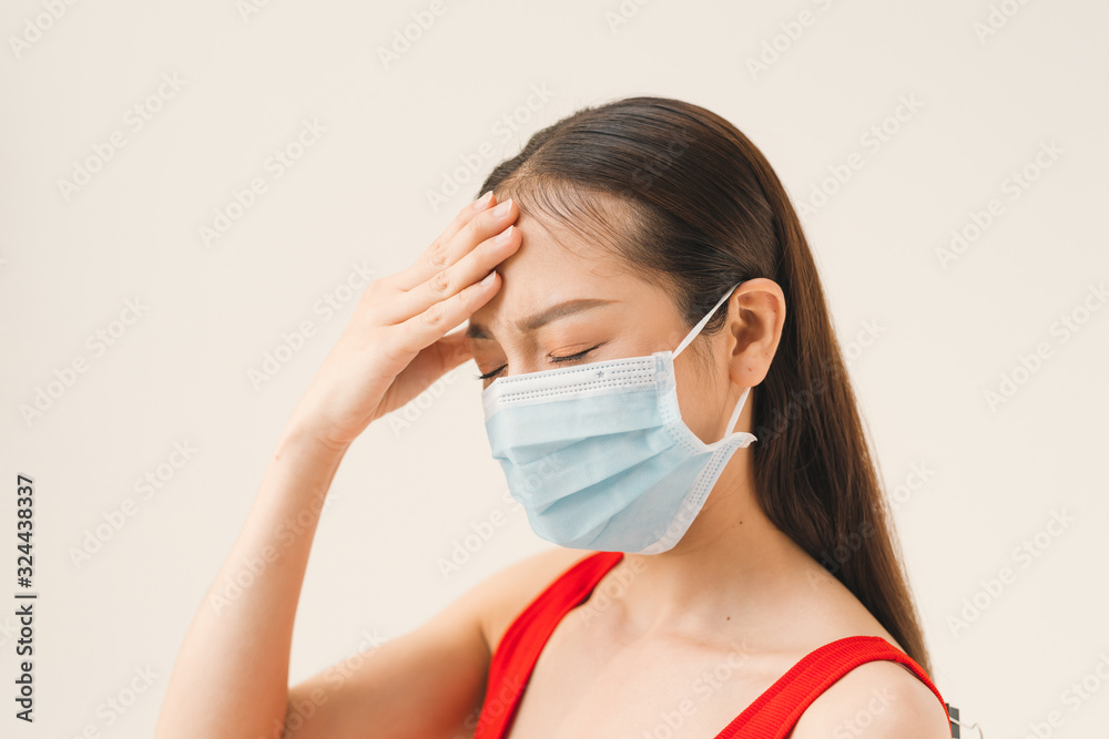 Asian women wear masks to protect disease and the headache from a virus on white background. Asian women wear masks to protect disease and the headache from a virus on white background.