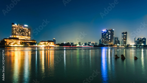 Bangkok's evening business city in Thailand and the river is the center.