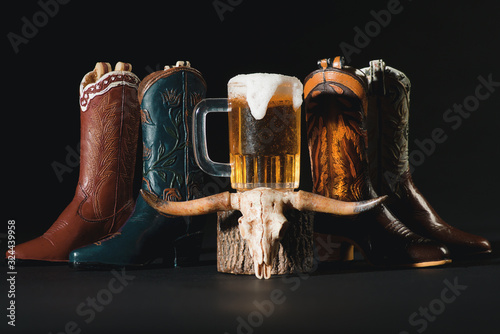 Four Cowboy Western Style Boots with Pitcher of Beer