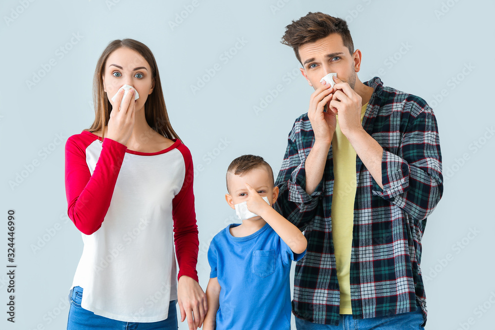 Family suffering from allergy on light background Family suffering from allergy on light background