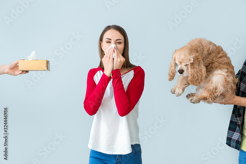 Young woman with pet allerg...