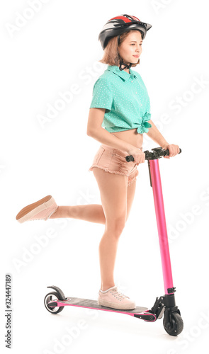 Teenage girl riding kick sc...