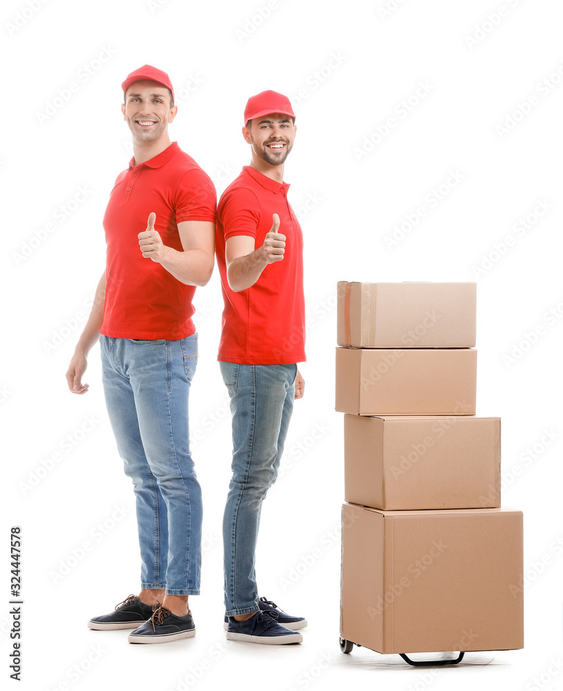 Delivery men with boxes showing thumb-up on white background Delivery men with boxes showing thumb-up on white background