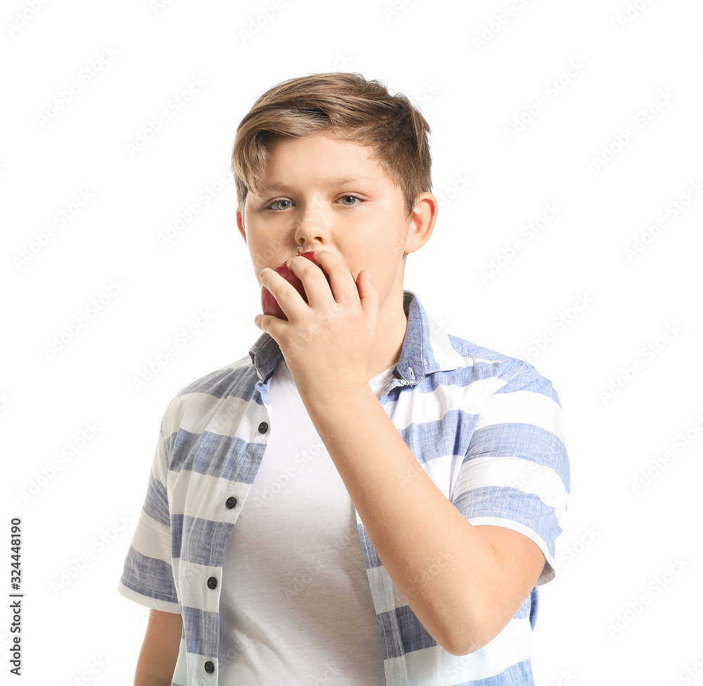 Overweight boy with apple on white background Overweight boy with apple on white background