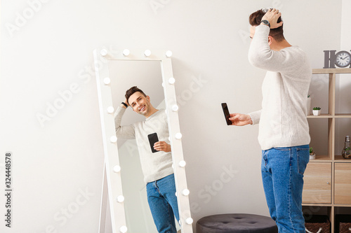 Handsome young man taking s...