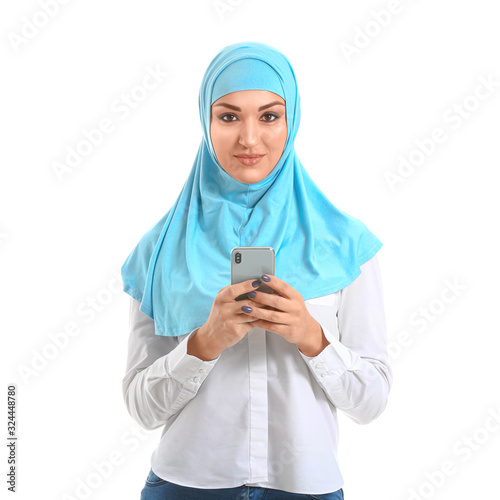 Young Arab woman with mobil...