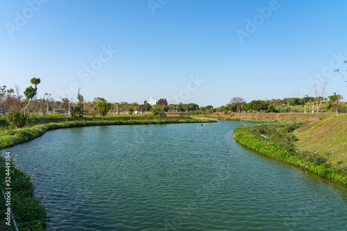 Taichung Central Park at the Shuinan Economic and Trade Area in blue sky sunny day. Former Shuinan Airport, lot of green space in here, the second largest park in Taiwan. Xitun District, Taichung City photo
