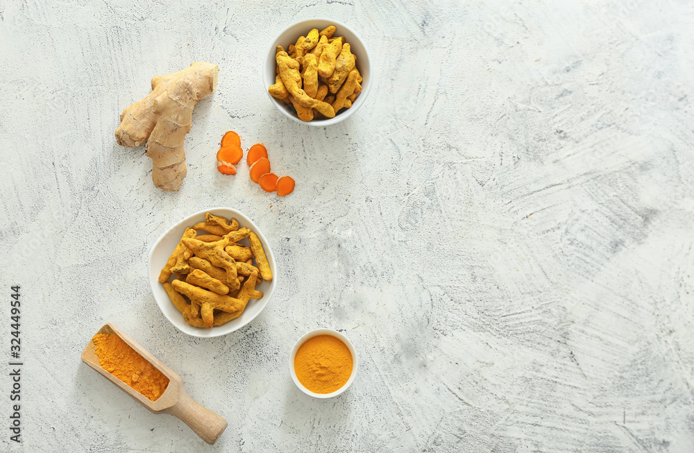Composition with aromatic turmeric on light background
